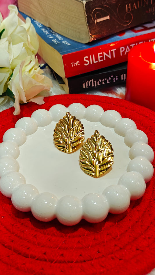 Golden Whisper: Enchanted Leaf Studs for the Bold  Beautiful