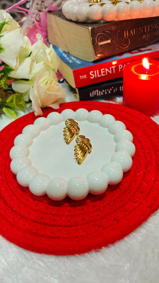 "Golden Embrace: Bold Twisted Elegance Studs for the Fearless Heart" at Dilverse