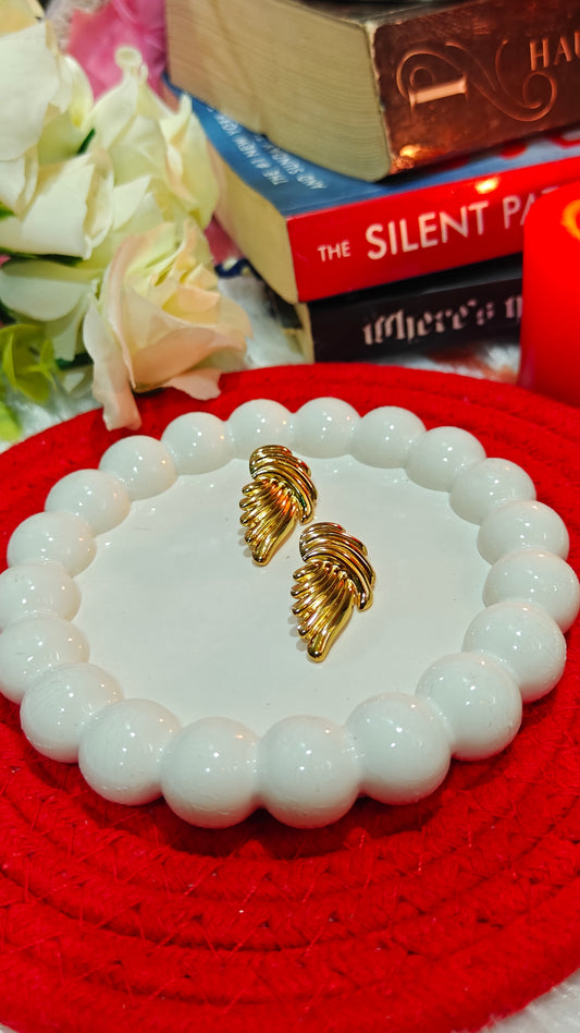 "Golden Embrace: Bold Twisted Elegance Studs for the Fearless Heart" at Dilverse