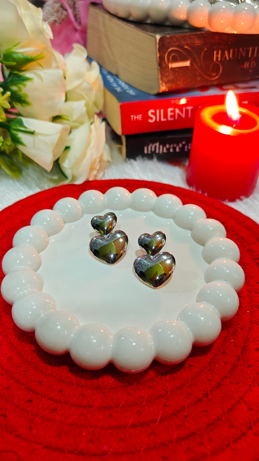 "Silver Whisper: Drop Earrings That Ignite Romance  Radiance"