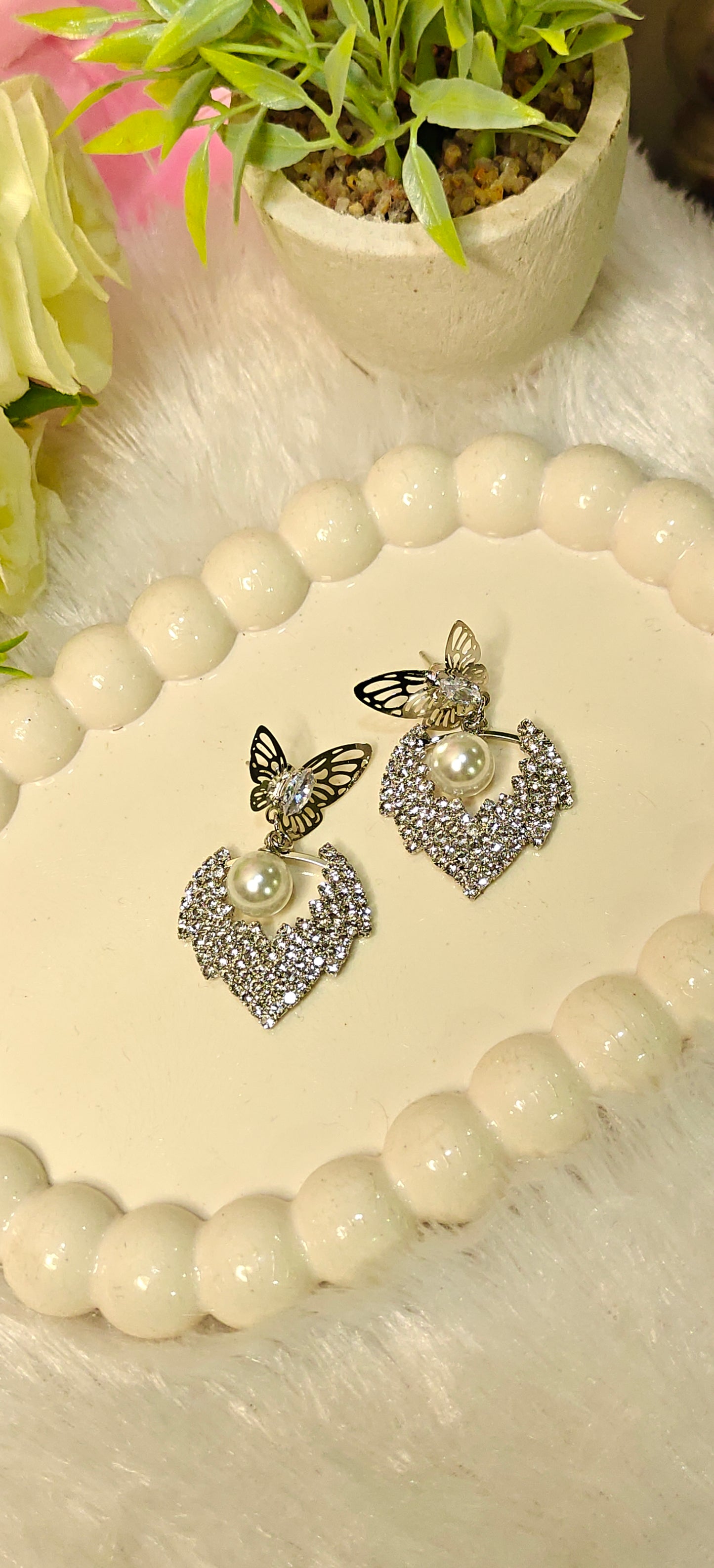 Radiant Butterfly Elegance with Pearl Sparkle at Dilverse