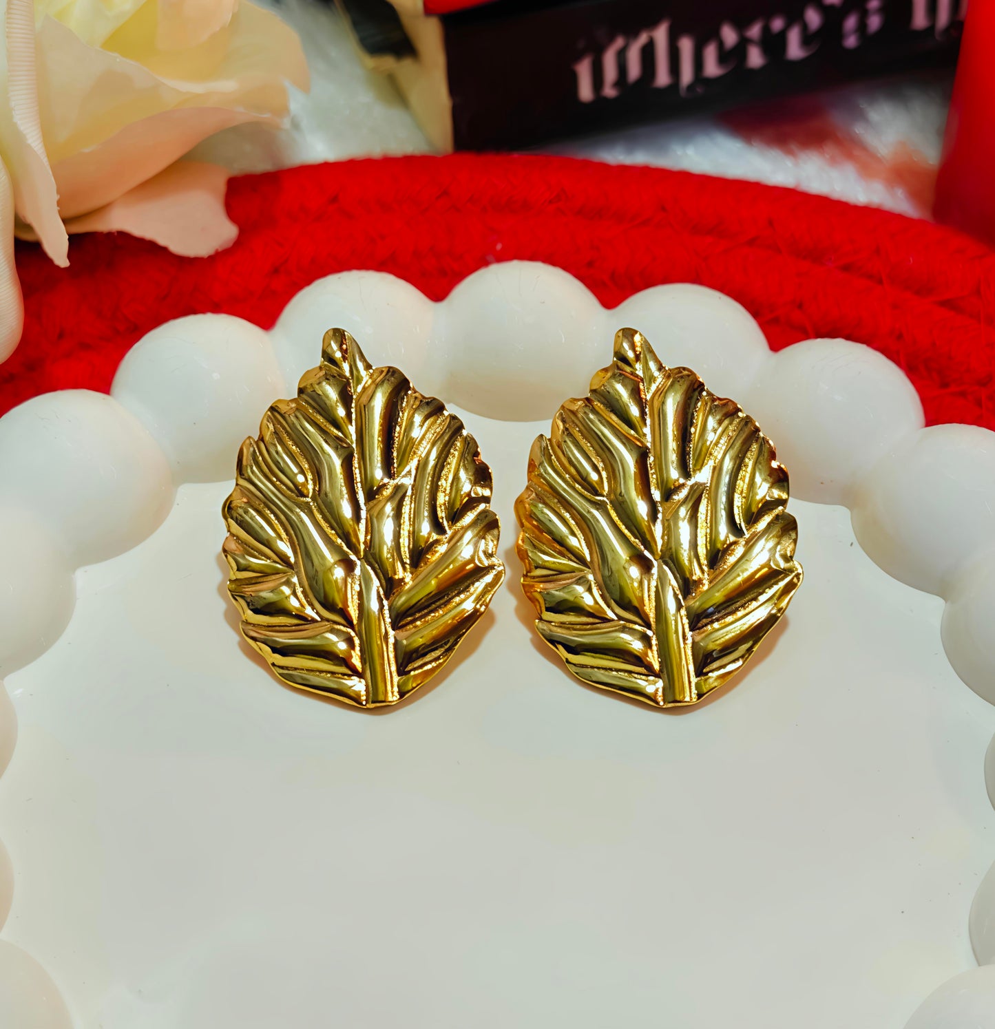Golden Whisper: Enchanted Leaf Studs for the Bold  Beautiful